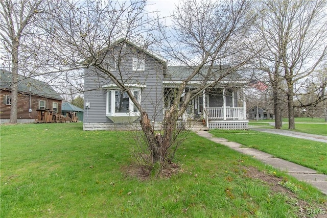 108 Mechanic St, Antwerp, NY 13608 - view of front facade with a front yard and a porch