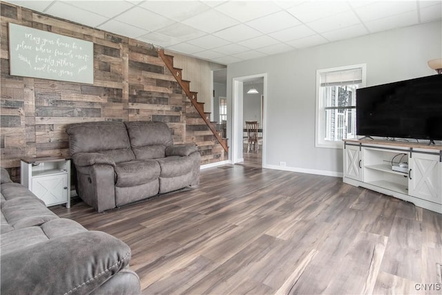 108 Mechanic St, Antwerp, NY 13608 - living room with stairway, a drop ceiling, baseboards, and wood finished floors
