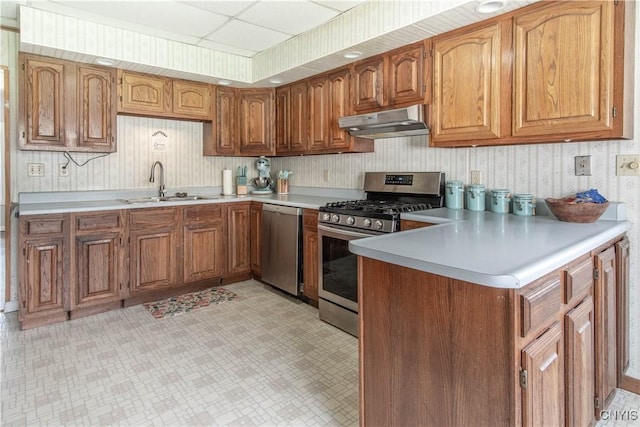 108 Mechanic St, Antwerp, NY 13608 - kitchen featuring under cabinet range hood, stainless steel appliances, a sink, and light countertops