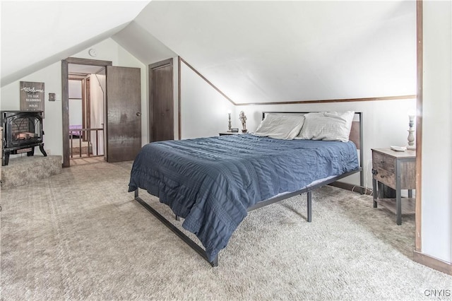 108 Mechanic St, Antwerp, NY 13608 - carpeted bedroom with a wood stove and lofted ceiling