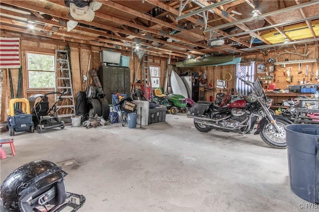108 Mechanic St, Antwerp, NY 13608 - garage with a workshop area and a garage door opener
