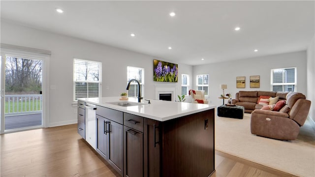 kitchen with recessed lighting, light countertops, and a sink
