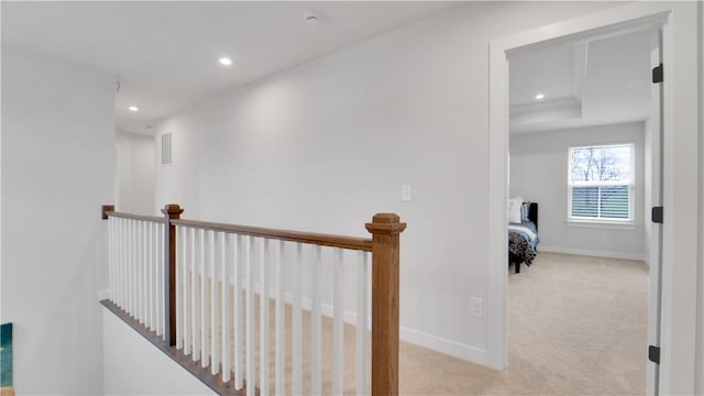 hall featuring carpet, an upstairs landing, visible vents, baseboards, and recessed lighting