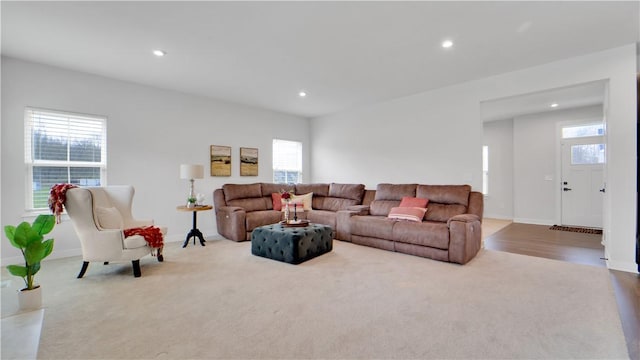 living room with carpet flooring, baseboards, and recessed lighting