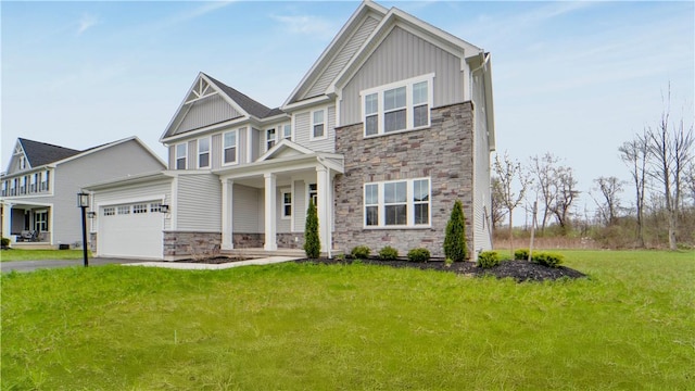 craftsman-style home featuring an attached garage, stone siding, driveway, a front lawn, and board and batten siding