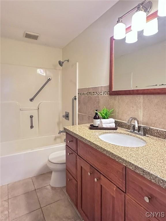 bathroom with toilet, visible vents, tile patterned flooring, vanity, and shower / bathing tub combination