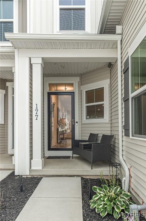 177 Sandstone Cir, Grand Island, NY 14072 - doorway to property with a porch and board and batten siding