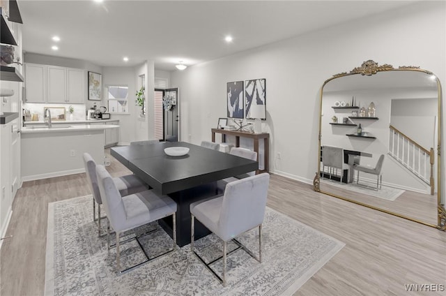 177 Sandstone Cir, Grand Island, NY 14072 - dining space with baseboards, stairs, light wood finished floors, and recessed lighting