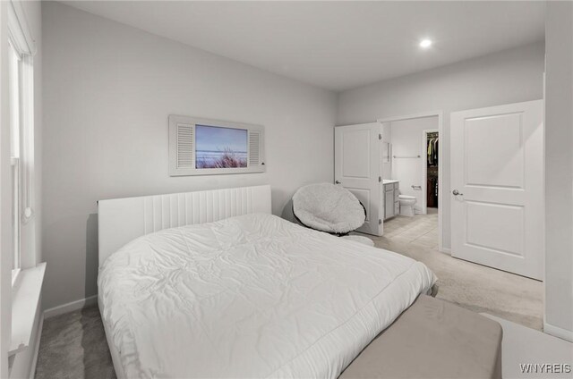177 Sandstone Cir, Grand Island, NY 14072 - bedroom featuring light colored carpet, connected bathroom, baseboards, and recessed lighting