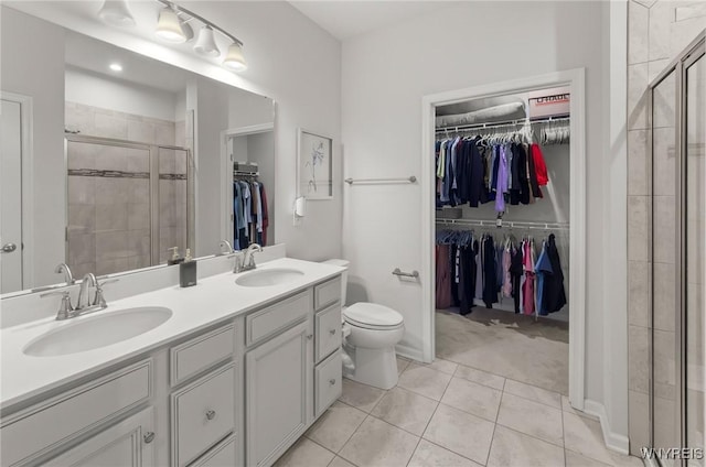 177 Sandstone Cir, Grand Island, NY 14072 - full bath featuring a sink, tile patterned flooring, a spacious closet, and a shower stall