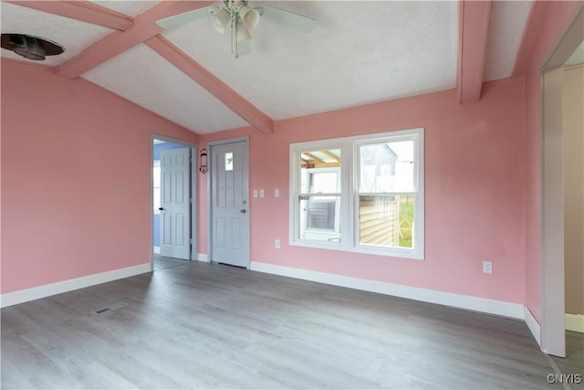 87 Kings Rd, Volney, NY 13069 - unfurnished living room with lofted ceiling with beams, baseboards, and wood finished floors
