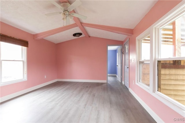 87 Kings Rd, Volney, NY 13069 - spare room featuring baseboards, a ceiling fan, vaulted ceiling with beams, and wood finished floors