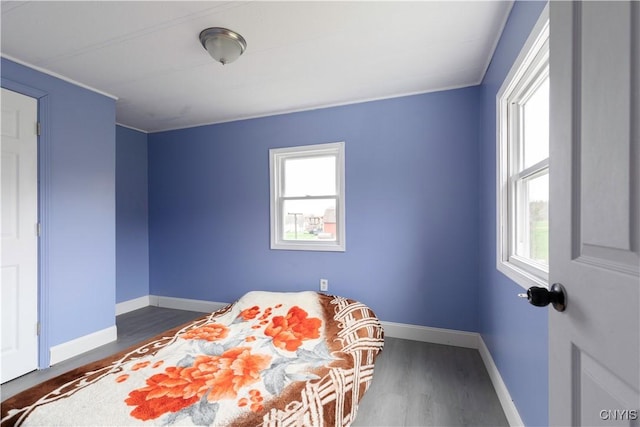 87 Kings Rd, Volney, NY 13069 - bedroom with wood finished floors, baseboards, and multiple windows