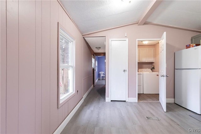 87 Kings Rd, Volney, NY 13069 - bonus room featuring washing machine and dryer, lofted ceiling with beams, light wood-type flooring, visible vents, and baseboards