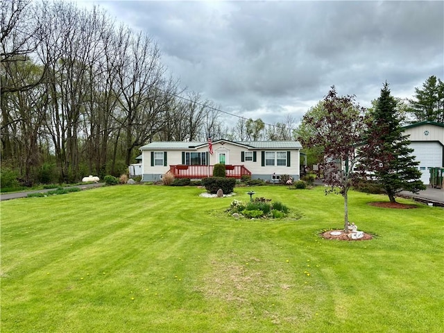397 Jerrysmith Rd, Lansing, NY 14850 - view of front of property featuring a deck, an outdoor structure, a front yard, and a garage