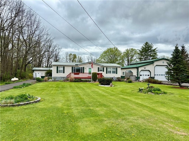 397 Jerrysmith Rd, Lansing, NY 14850 - exterior space featuring a front lawn, an outdoor structure, a deck, and a garage
