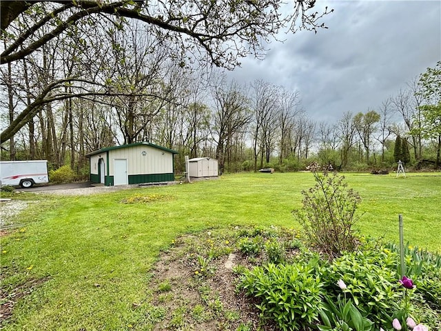 397 Jerrysmith Rd, Lansing, NY 14850 - view of yard featuring an outbuilding and a storage unit