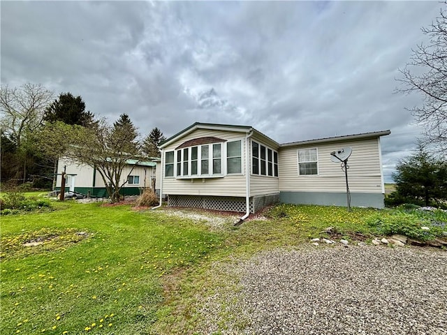 397 Jerrysmith Rd, Lansing, NY 14850 - back of house with a lawn