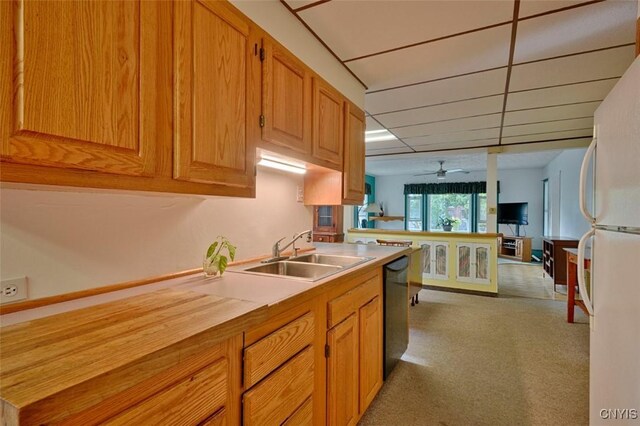18 Crossmon St, Alexandria, NY 13607 - kitchen featuring a ceiling fan, a sink, freestanding refrigerator, black dishwasher, and light colored carpet