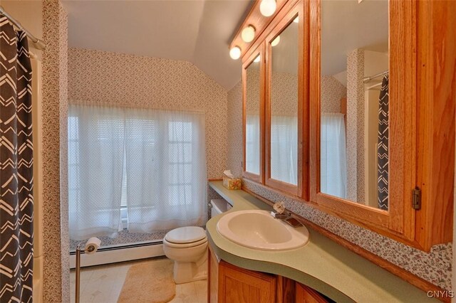 18 Crossmon St, Alexandria, NY 13607 - bathroom with a baseboard radiator, wallpapered walls, toilet, vanity, and vaulted ceiling