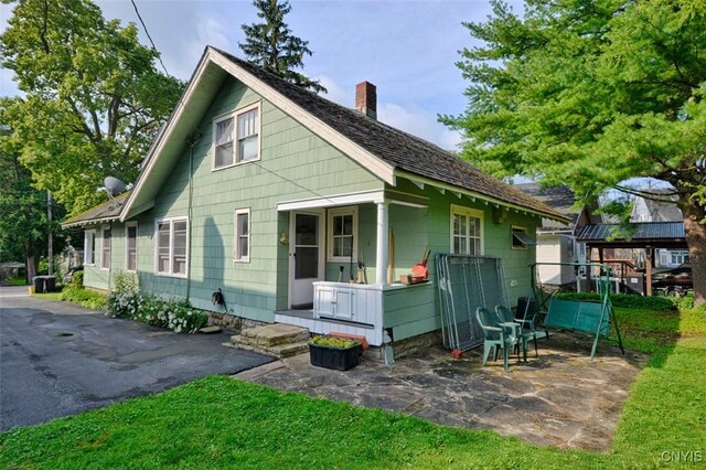 18 Crossmon St, Alexandria, NY 13607 - view of front of property with a chimney