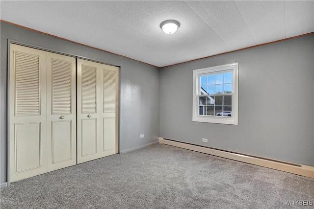 9862 Rte 219, Ashford, NY 14171 - unfurnished bedroom with carpet, a closet, a textured ceiling, baseboards, and a baseboard heating unit