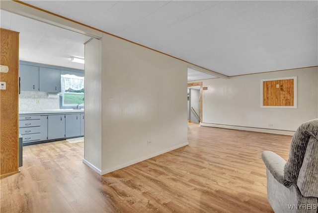 9862 Rte 219, Ashford, NY 14171 - living area with baseboards, baseboard heating, and light wood finished floors
