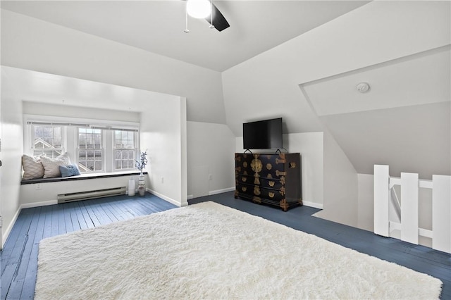 bedroom with a ceiling fan, hardwood / wood-style floors, baseboards, vaulted ceiling, and a baseboard radiator