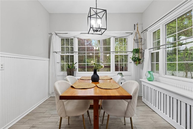 sunroom with a notable chandelier