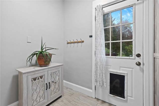 entryway featuring baseboards