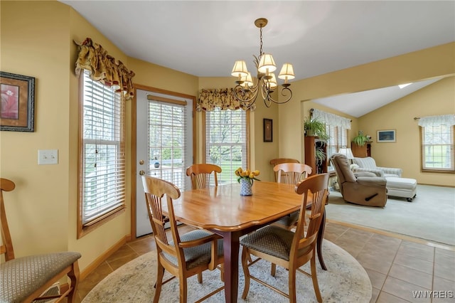 dining room featuring light tile patterned flooring, baseboards, vaulted ceiling, light carpet, and a notable chandelier