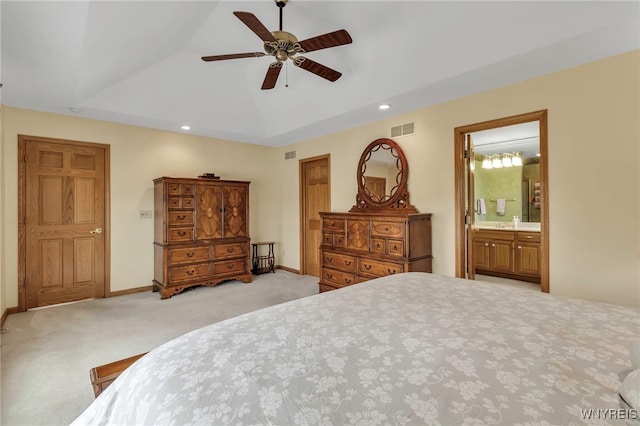 carpeted bedroom featuring recessed lighting, a raised ceiling, visible vents, and vaulted ceiling