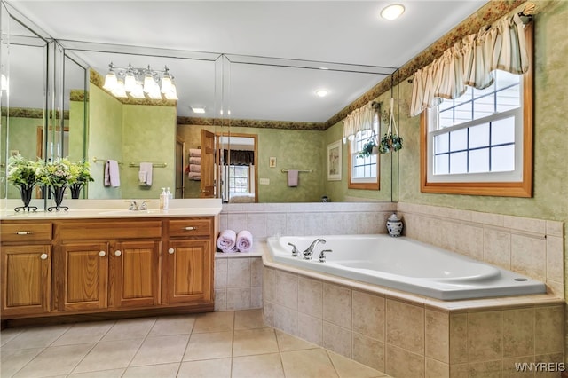 full bath featuring tile patterned floors, vanity, and a bath