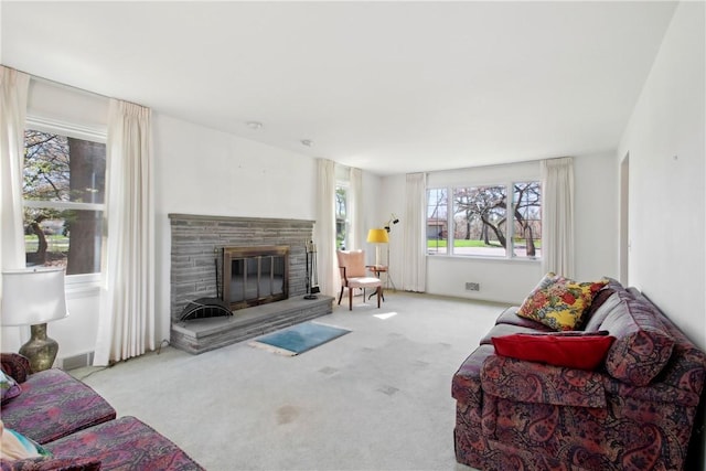 carpeted living area featuring a fireplace