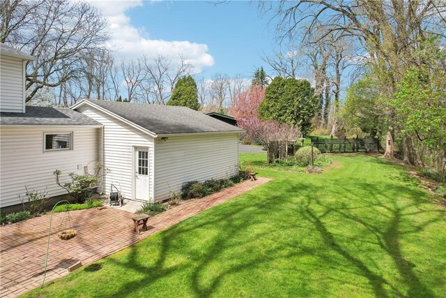 view of yard featuring a patio and fence