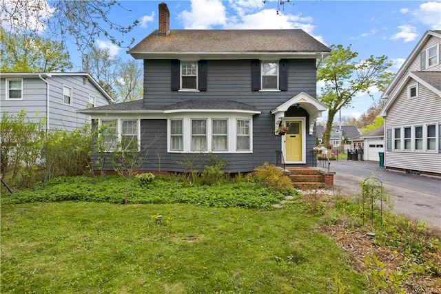 247 Fair Oaks Ave, Brighton, NY 14618 - traditional-style home featuring a shingled roof, a garage, a chimney, and a front lawn
