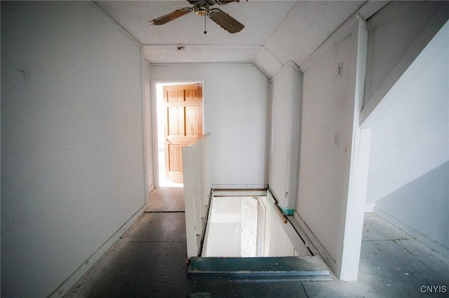 corridor with vaulted ceiling