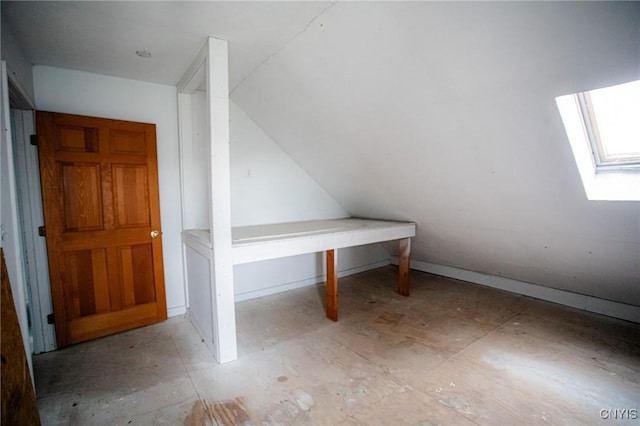 additional living space featuring a skylight