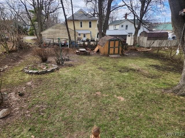 106 Saxton St, Lockport City, NY 14094 - view of yard with an outbuilding, fence, and a storage unit