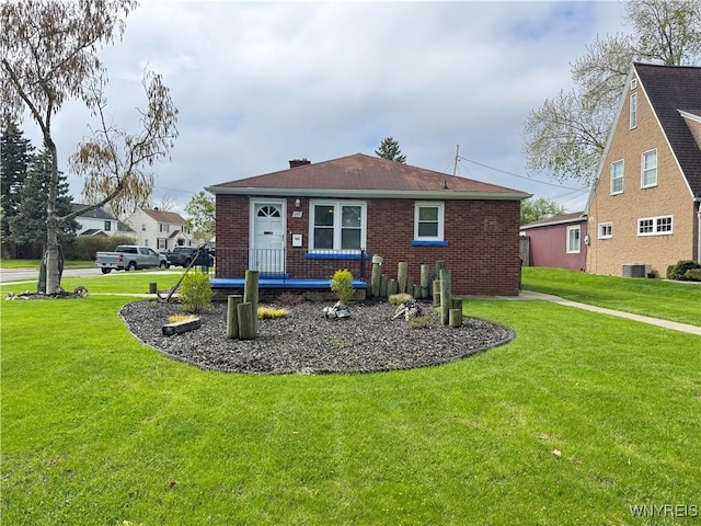 797 Van Rensselaer Ave, Niagara Falls, NY 14305 - back of property featuring central AC, brick siding, and a lawn