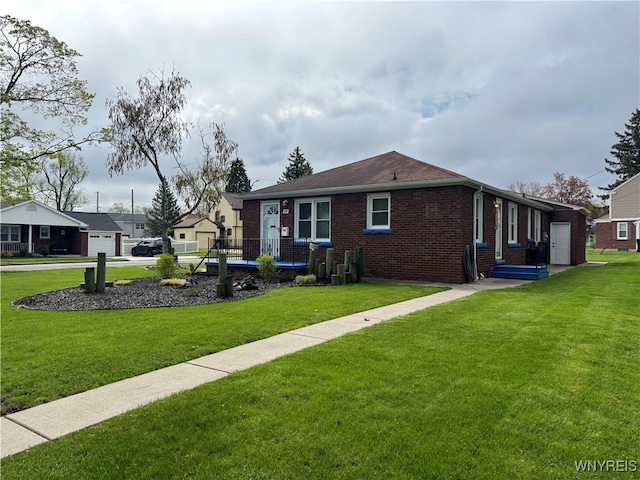 797 Van Rensselaer Ave, Niagara Falls, NY 14305 - view of front of home featuring brick siding and a front lawn