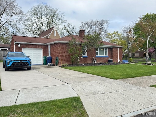 797 Van Rensselaer Ave, Niagara Falls, NY 14305 - view of front of property with a front lawn, driveway, brick siding, and an attached garage