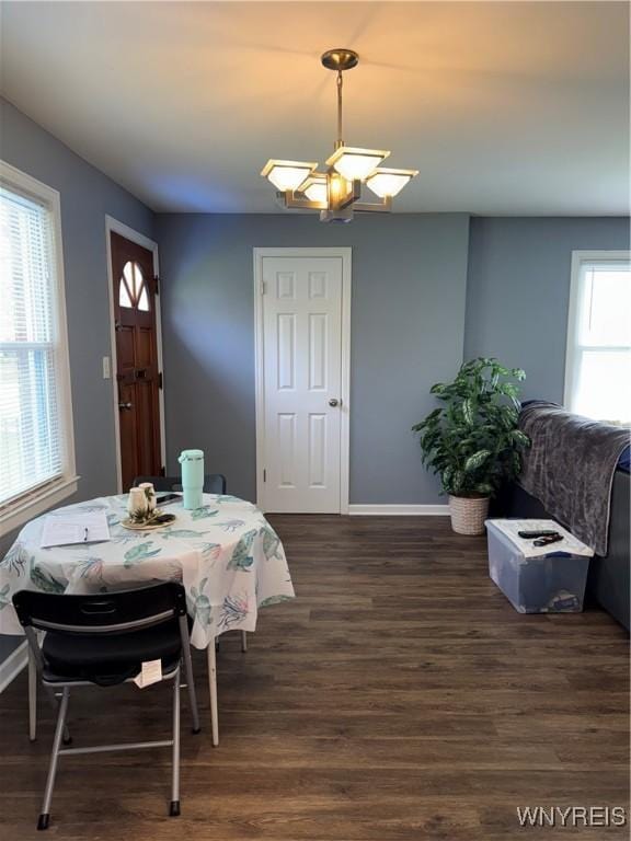 797 Van Rensselaer Ave, Niagara Falls, NY 14305 - dining area featuring baseboards, dark wood-style floors, and a notable chandelier
