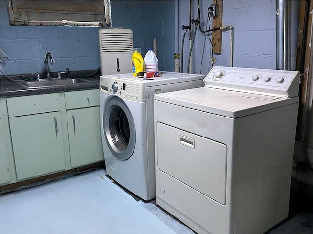 616 Hart St, Elmira-City, NY 14901 - laundry room featuring concrete block wall, washer and dryer, cabinet space, and a sink