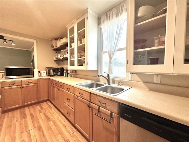 616 Hart St, Elmira-City, NY 14901 - kitchen featuring glass insert cabinets, a sink, stainless steel appliances, light wood-type flooring, and light countertops
