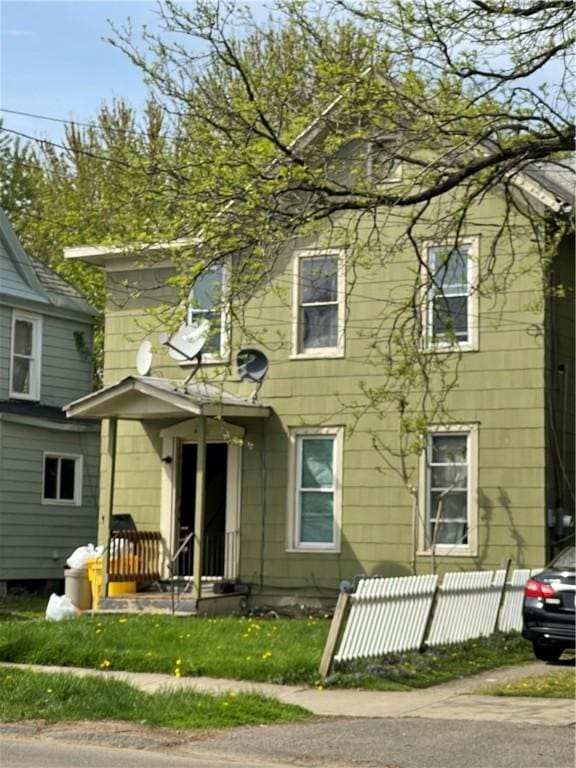 view of front of home with fence
