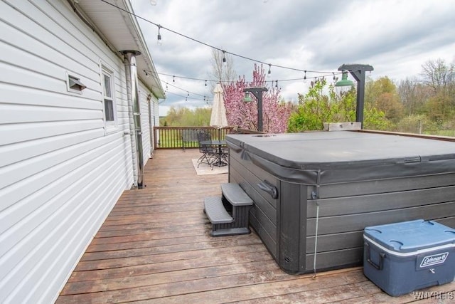 deck featuring a hot tub