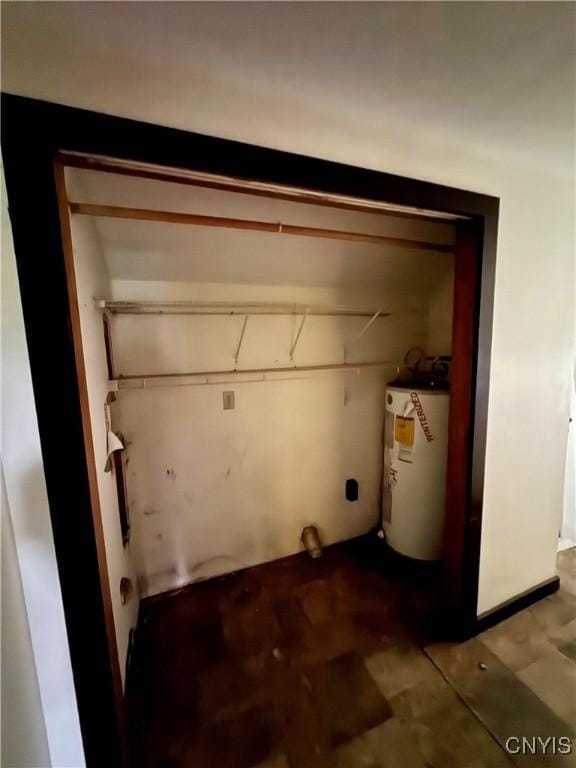 32 Spencer St, Gouverneur, NY 13642 - clothes washing area featuring water heater
