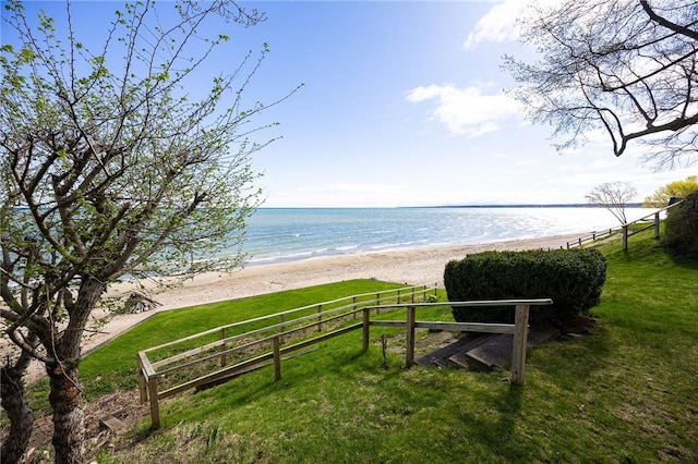 water view with nearby beach and fence