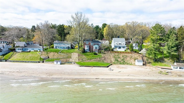 aerial perspective of suburban area featuring a nearby body of water